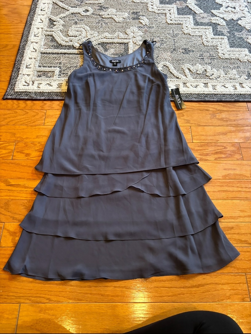 SLNY navy blue dress with ruffled tiers and beaded neckline, size 10